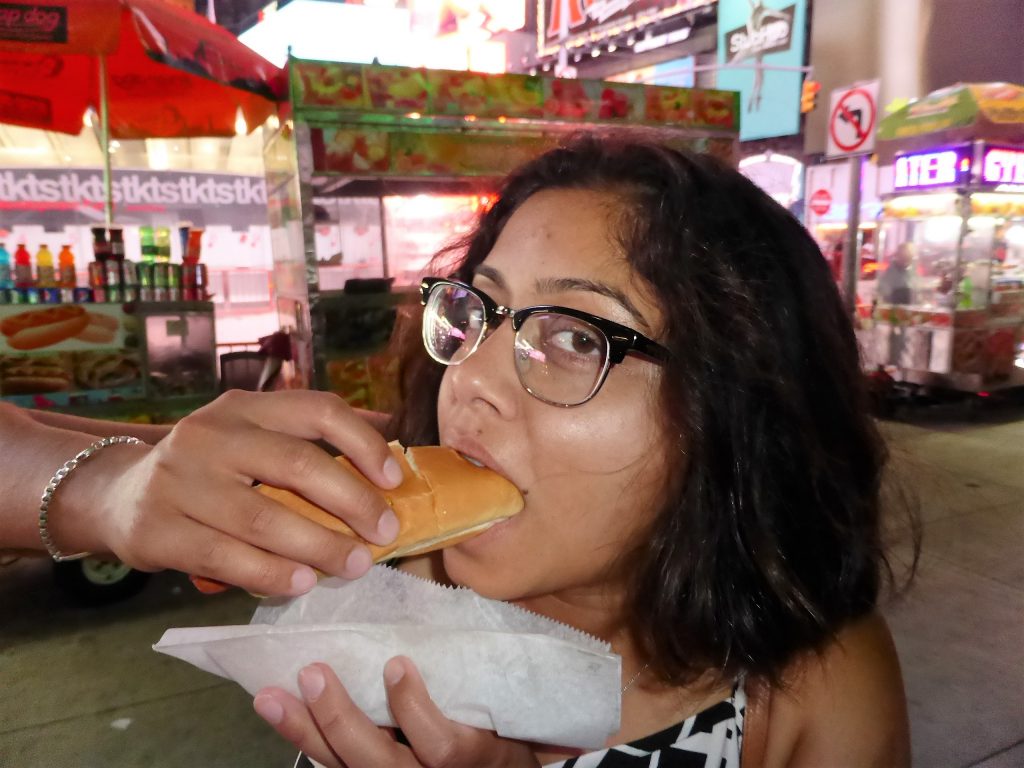 Eating a roadside hotdog